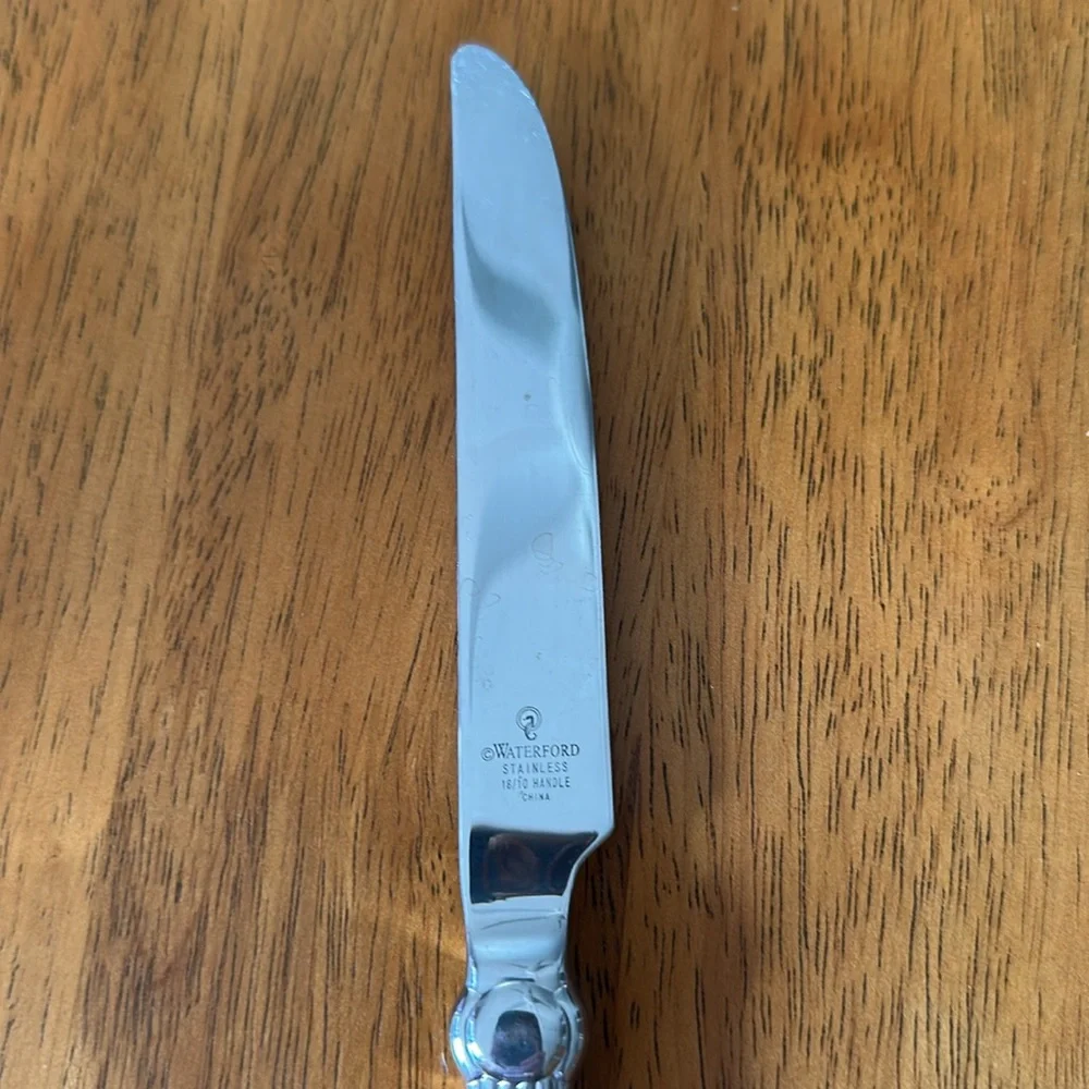 Waterford stainless butter knife. 18/10 handle. Carleton pattern. 9 3/4”.
